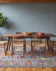 Maya Artisan Blue Hand Tufted Wool Rug in a dining room