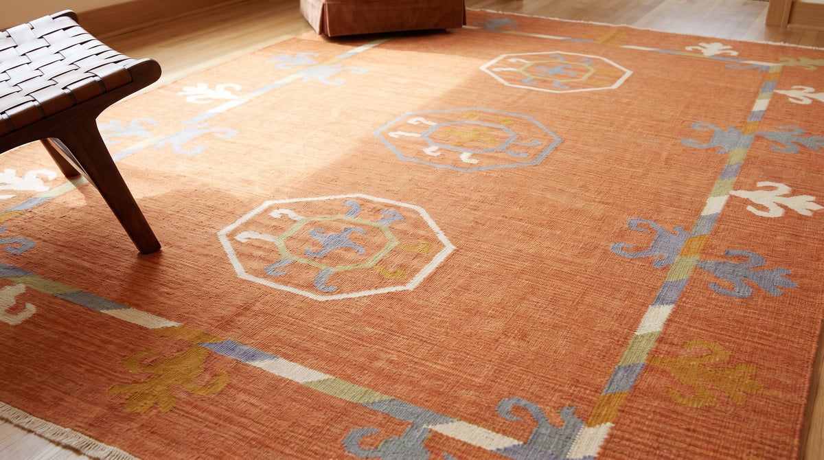 Maya Kilim Rust Flatweave Wool Rug in a living room
