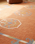 Maya Kilim Rust Flatweave Wool Rug in a living room