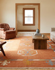 Maya Kilim Rust Flatweave Wool Rug in a living room