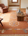 Maya Kilim Rust Flatweave Wool Rug in a living room