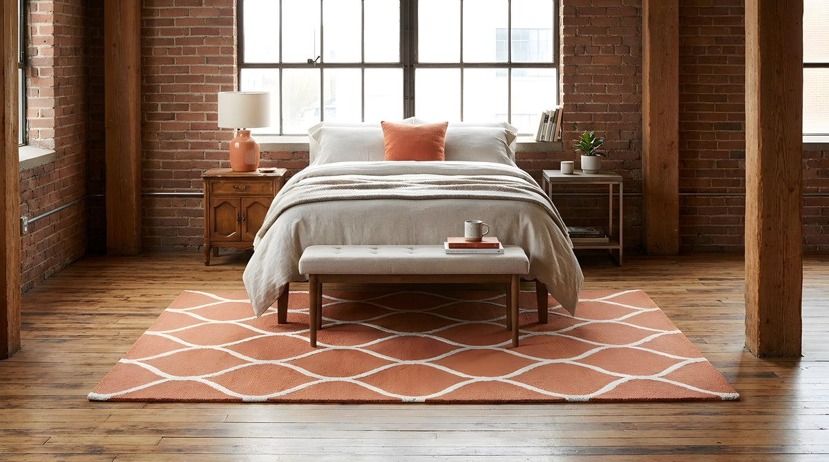 Maya Rustic Orange Hand Tufted Wool Rug in a bedroom