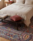 Maya Timeless Blue Hand Tufted Wool Rug in a bedroom