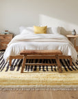 Mira Iris Yellow Hand Knotted Wool Rug in a bedroom