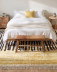 Mira Iris Yellow Hand Knotted Wool Rug in a bedroom