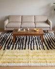 Mira Iris Yellow Hand Knotted Wool Rug in a living room