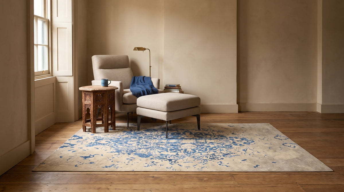 Modern Classic Blue Machine Made Rug in a reading nook