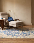 Modern Classic Blue Machine Made Rug in a reading nook