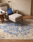Modern Classic Blue Machine Made Rug in a reading nook