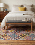 Nadia Kilim Multicolor Flatweave Wool Rug in a bedroom