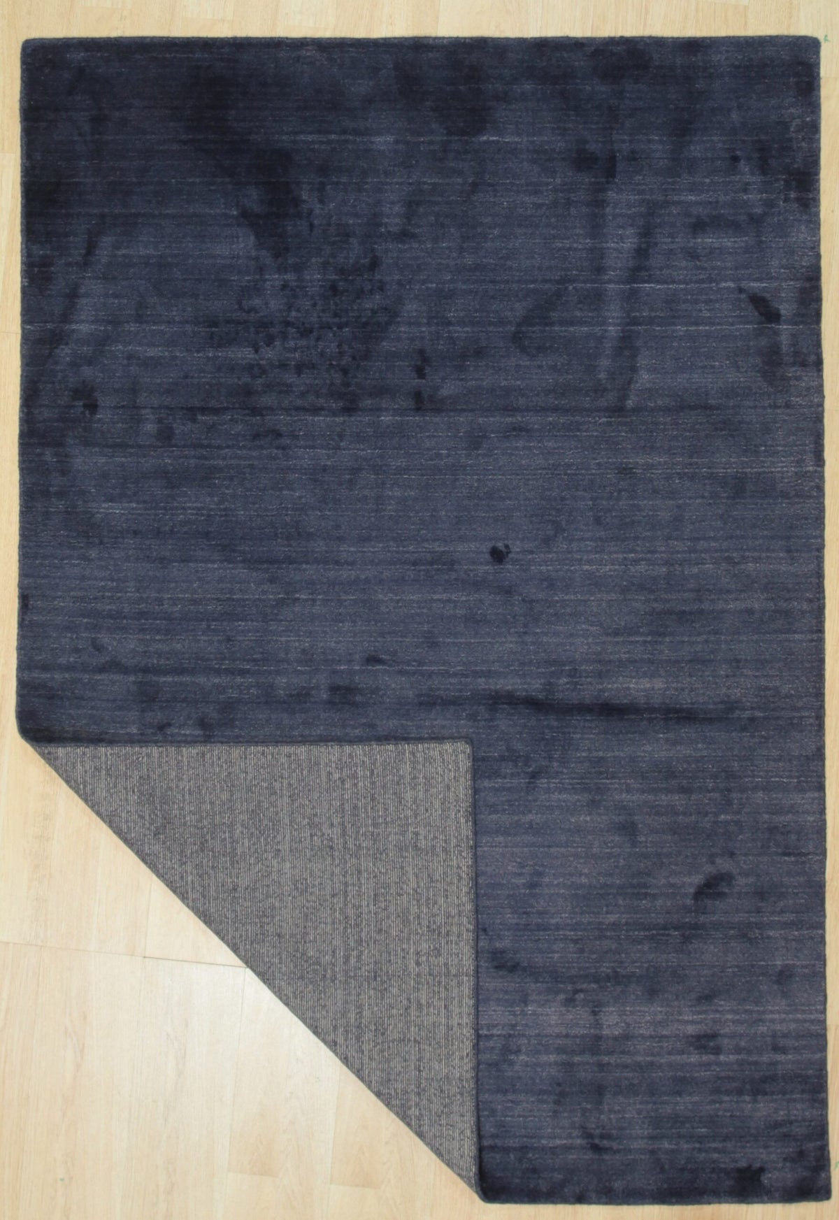 Navy blue solid handmade wool and viscose rug