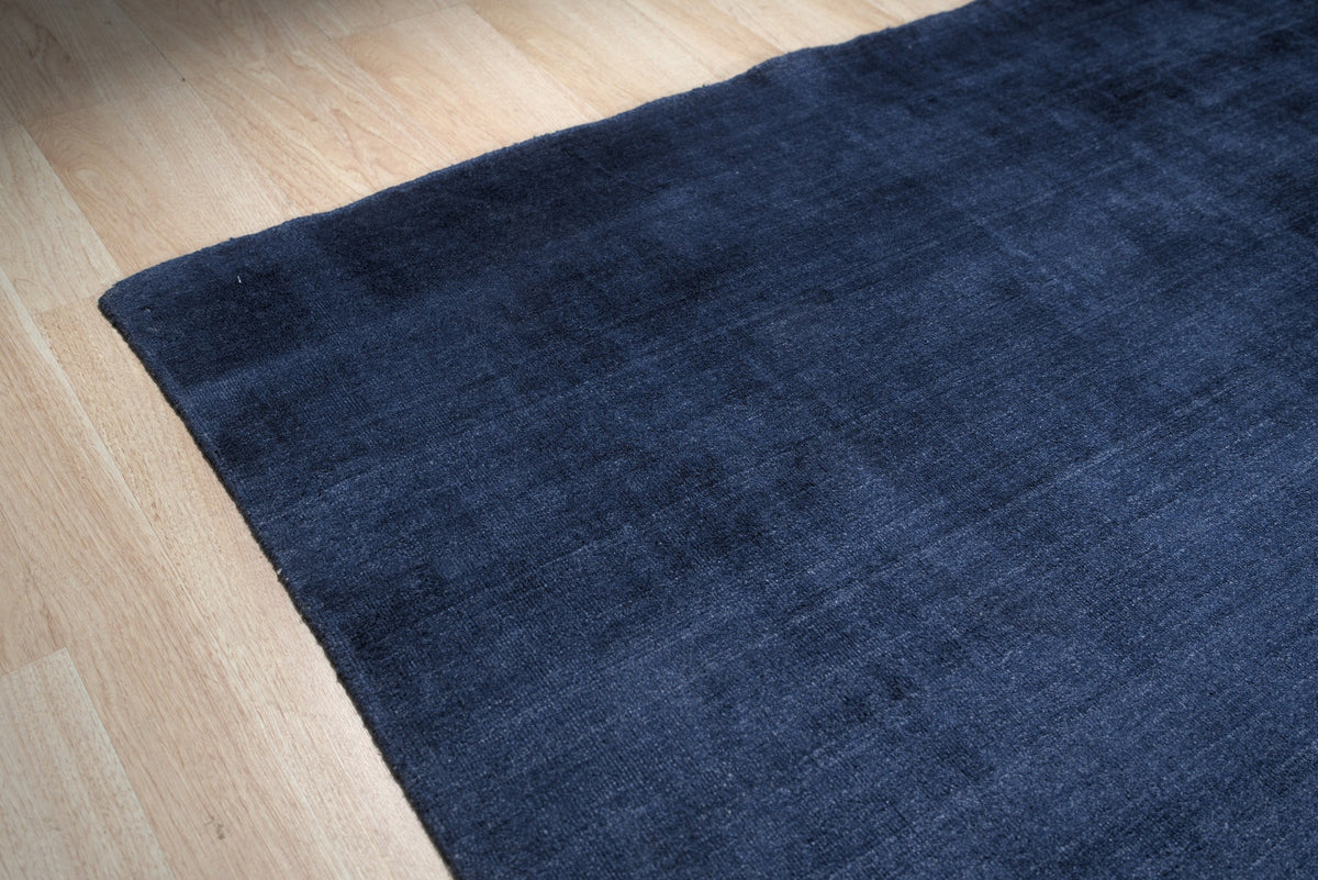Navy blue solid handmade wool and viscose rug