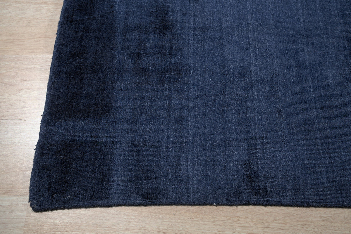 Navy blue solid handmade wool and viscose rug