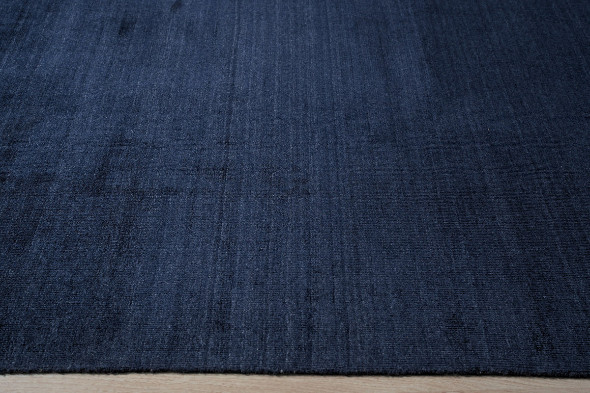 Navy blue solid handmade wool and viscose rug