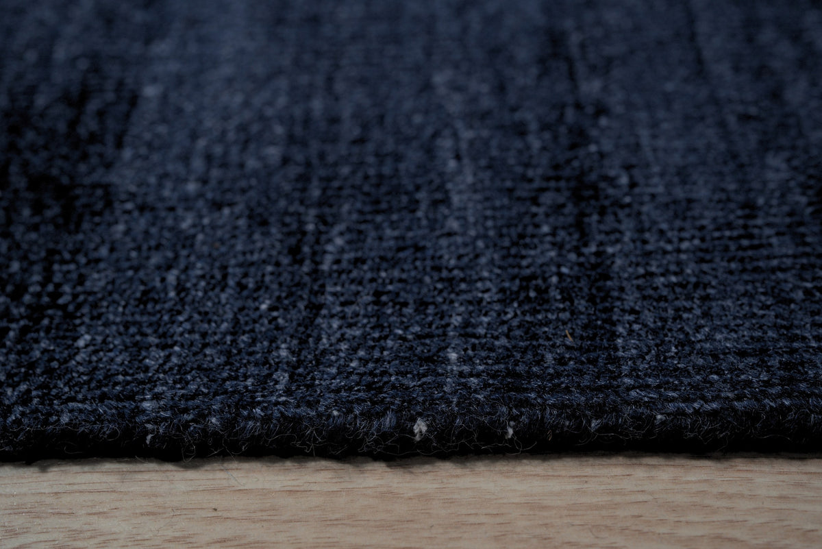 Navy blue solid handmade wool and viscose rug