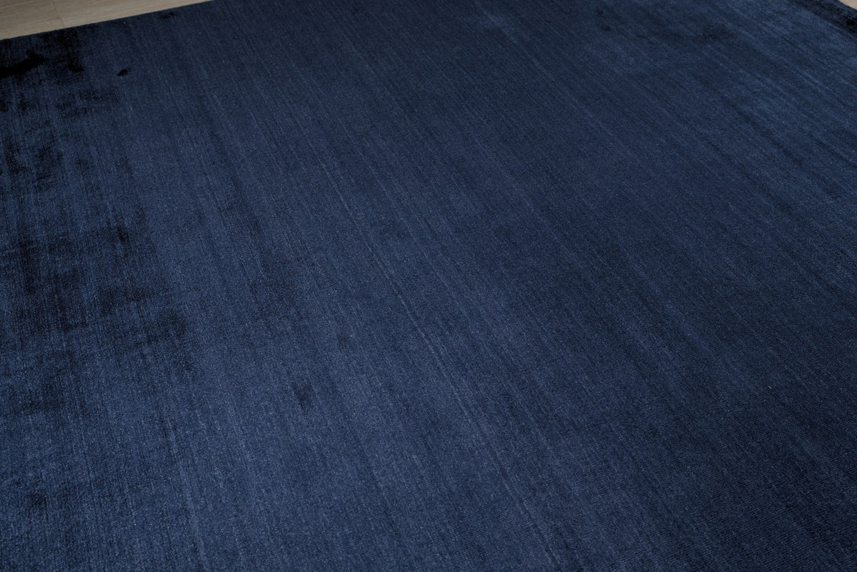 Navy blue solid handmade wool and viscose rug