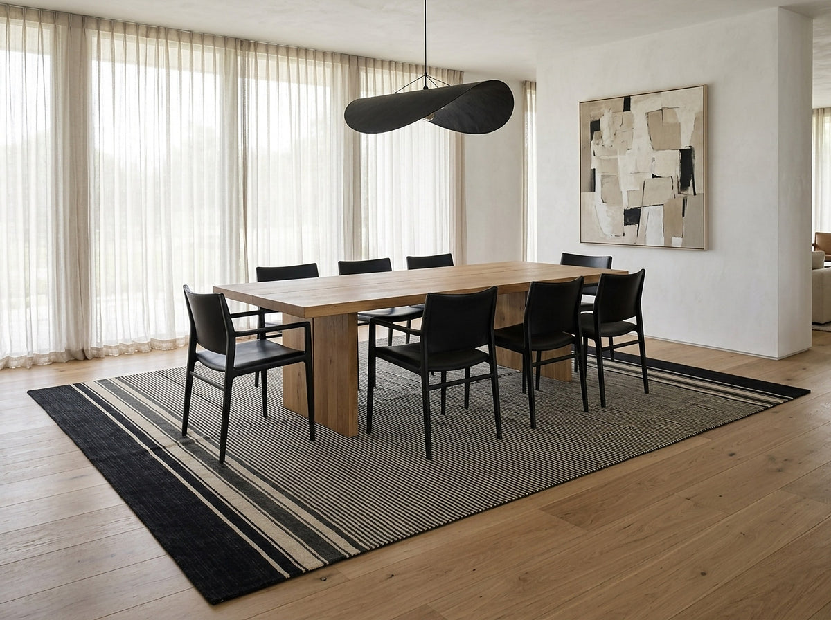 Black and Beige Stripe Handmade Wool Rug styled in a dining room