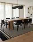 Black and Beige Stripe Handmade Wool Rug styled in a dining room