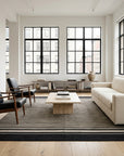 Black and Beige Stripe Handmade Wool Rug styled in a living room