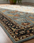 Gray and navy traditional hand-knotted wool rug KR110GY displayed in a room scene