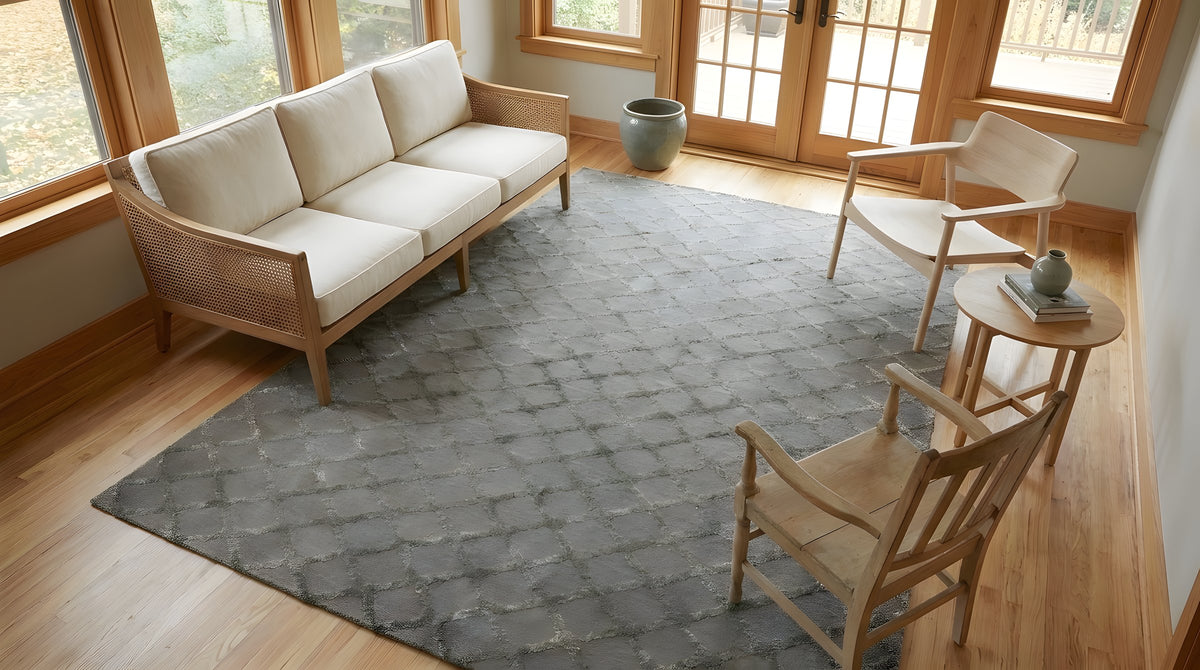 Nina Marrakesh Dark Gray Hand Knotted Wool & Viscose Rug in a sunroom
