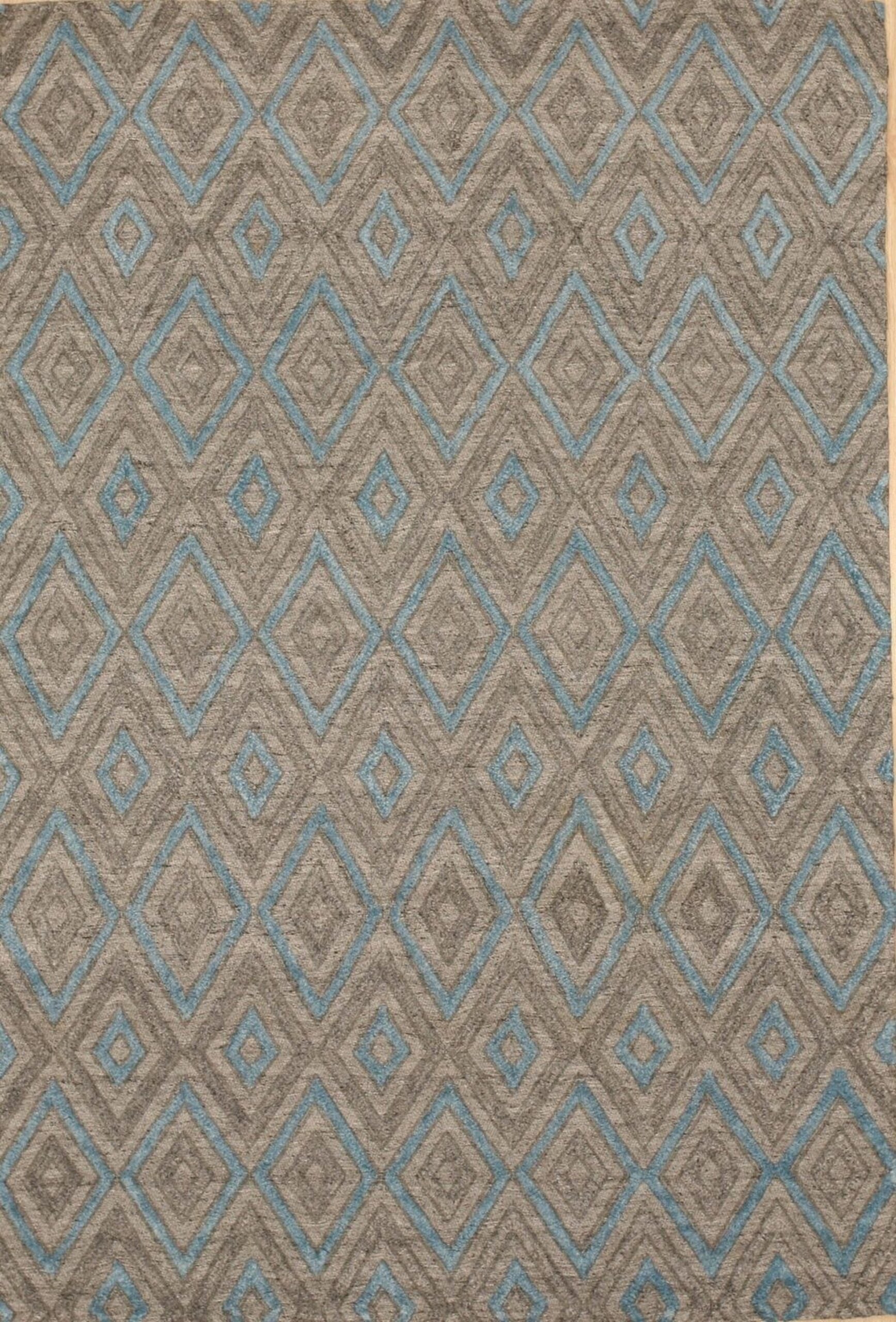 Gray transitional trellis handmade wool and viscose area rug styled in a living room