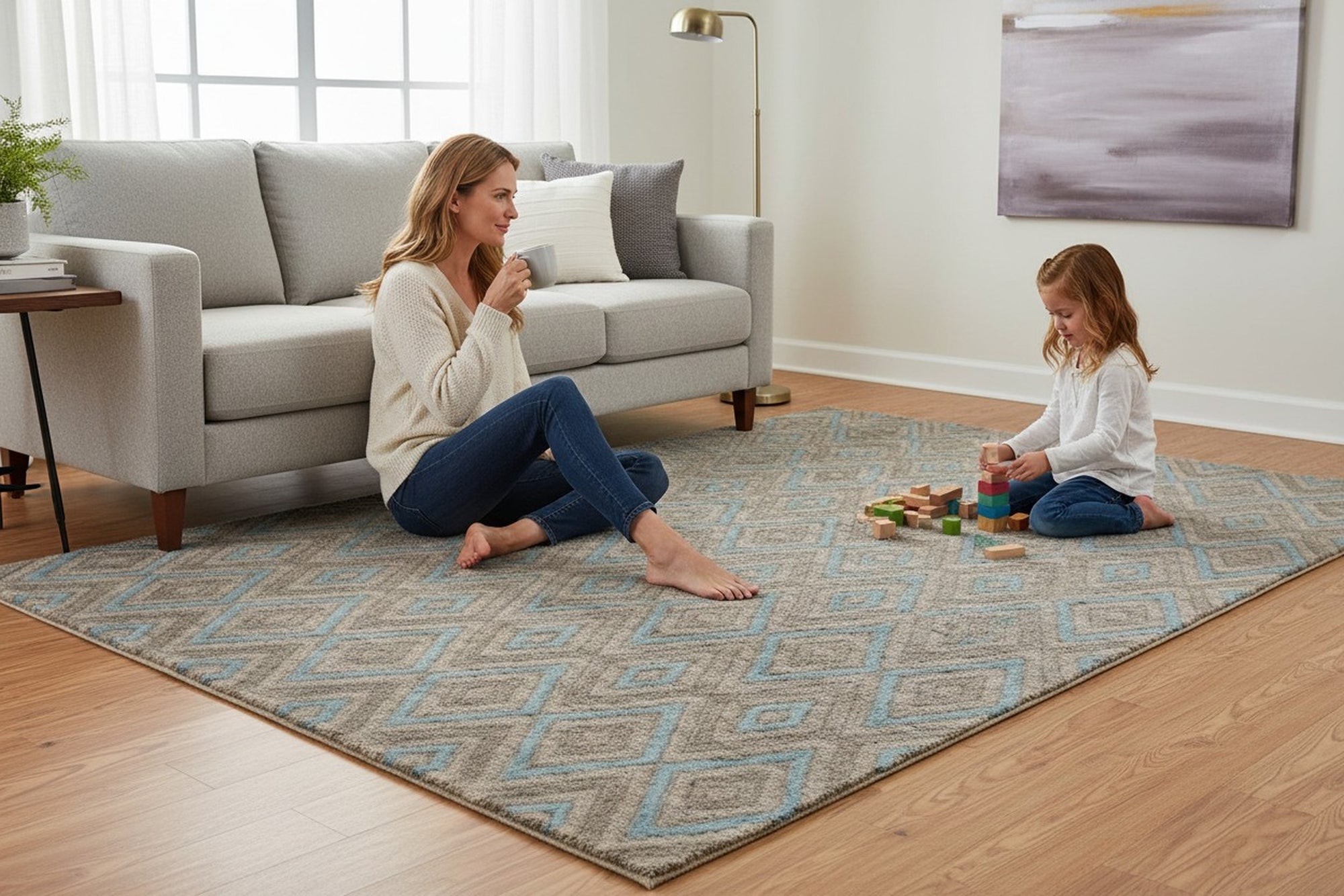 Gray transitional trellis handmade wool and viscose area rug styled in a living room