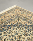 Ivory Naiin traditional oriental hand-knotted wool and silk area rug