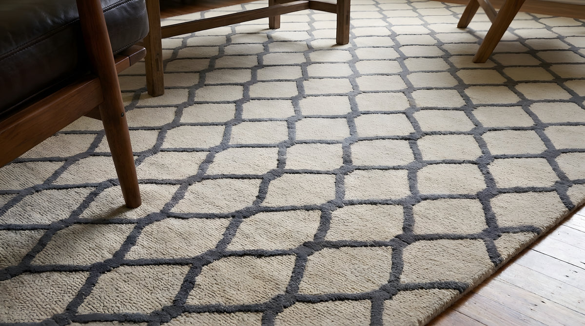 Ophelia Timeless Beige Hand Tufted Wool Rug in a living room