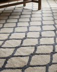Ophelia Timeless Beige Hand Tufted Wool Rug in a living room
