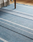 Opulent Majestic Blue Flatweave Wool Rug in a bedroom