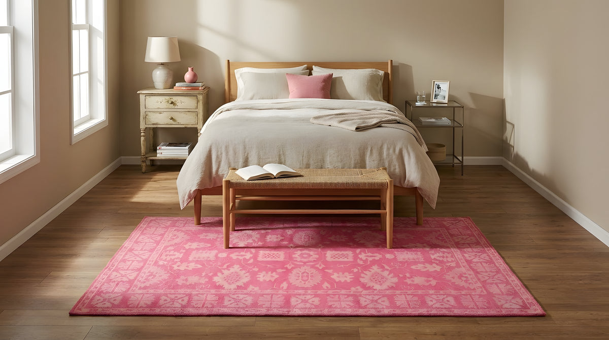 Opulent Oriental Pink Hand Tufted Wool Rug in a bedroom