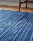 Para Penelope Blue Flatweave Wool Rug in a home office