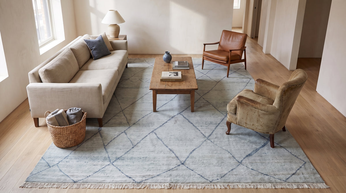 Penelope Diamond Silver Hand Knotted Wool Rug in a living room
