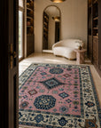 Pink and ivory Kazak rug in a dressing room