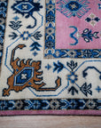 Pink ivory Kazak rug corner detail with ivory border