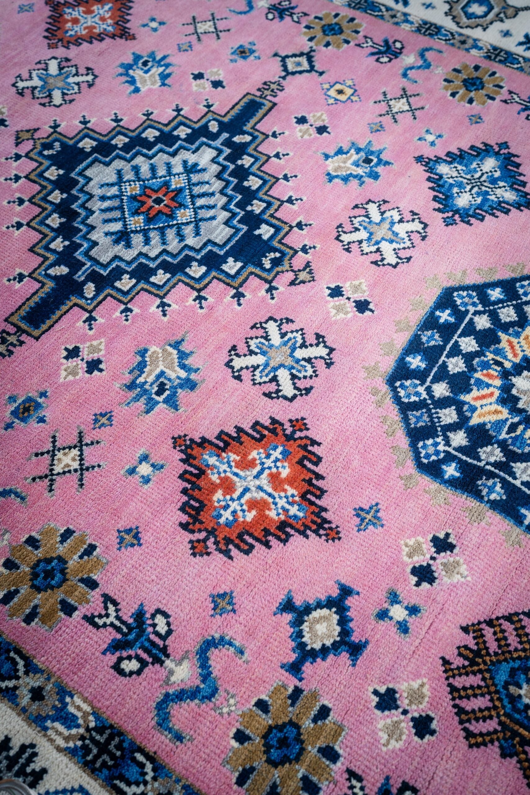 Pink ivory Kazak rug top-down field detail