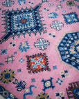 Pink ivory Kazak rug top-down field detail