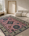 Pink ivory Kazak rug styled in a living room