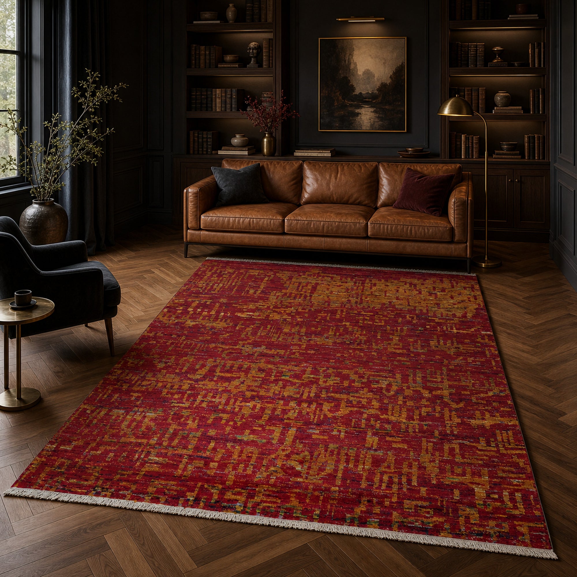 Red abstract sari-silk Anand rug in a moody library with leather sofa