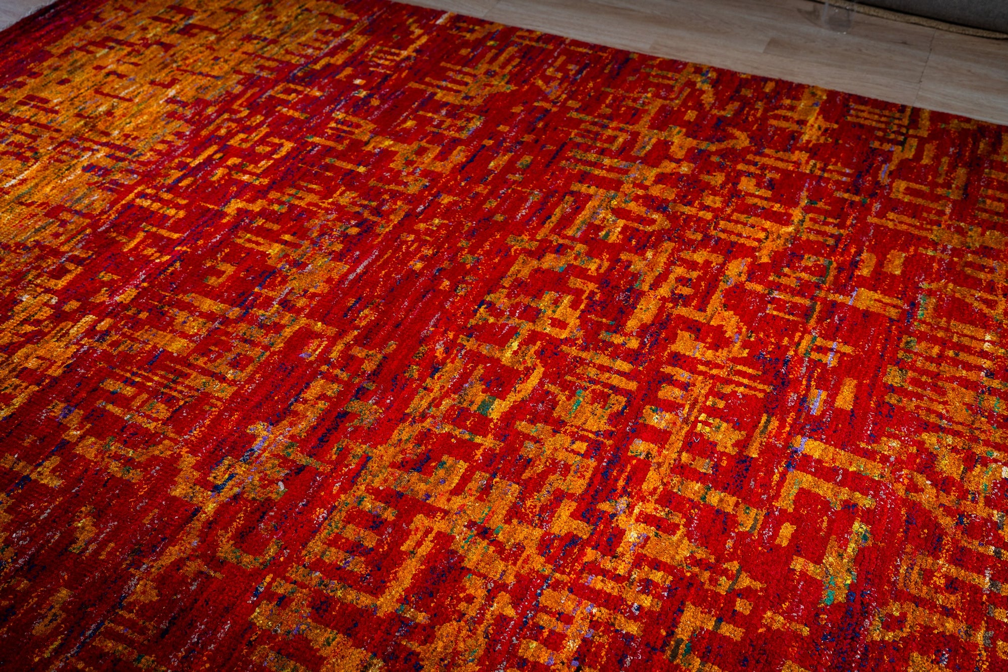 Sari-silk red abstract Anand rug angled full-field view