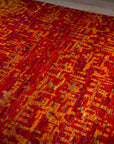 Sari-silk red abstract Anand rug angled full-field view