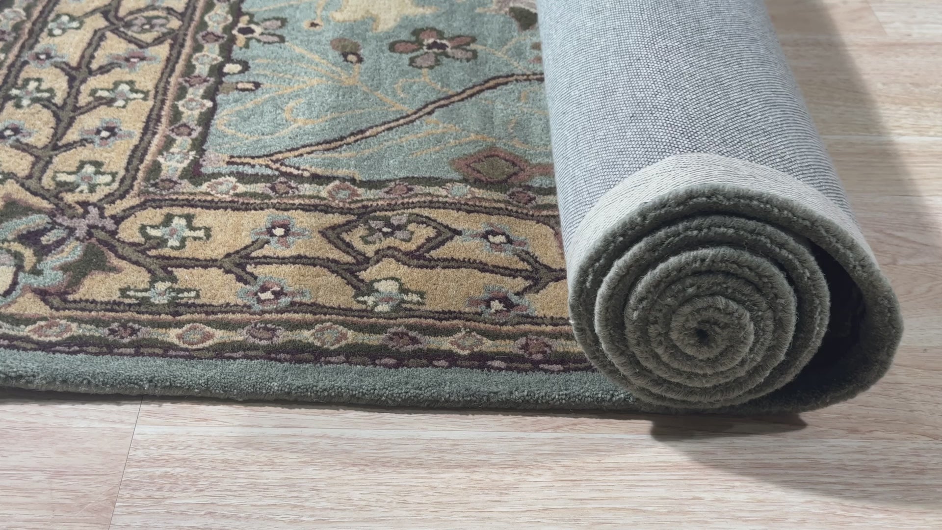 Given the image position is 10, here's the alt text:
 
 Laine Majestic Blue Hand Tufted Wool Rug enriching a living space, its deep blue tones and luxurious wool texture complementing modern furniture. Hand tufted construction creates a plush and inviting feel.