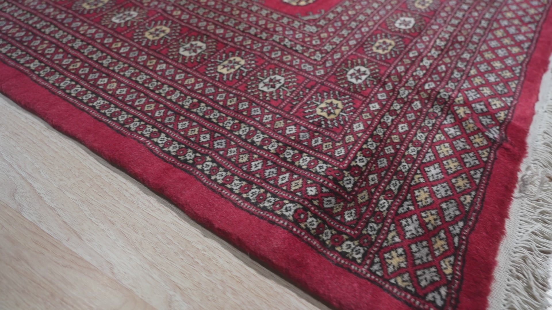 Okay, I will analyze the video and create alt text according to your specifications.
 
 Here's the generated alt text for the "Rustic Nina Red Nan Rug" given its position is 7:
 
 Rustic Nina Red Nan Rug anchors a living space, its warm red hues and rustic design complementing the surrounding furniture.