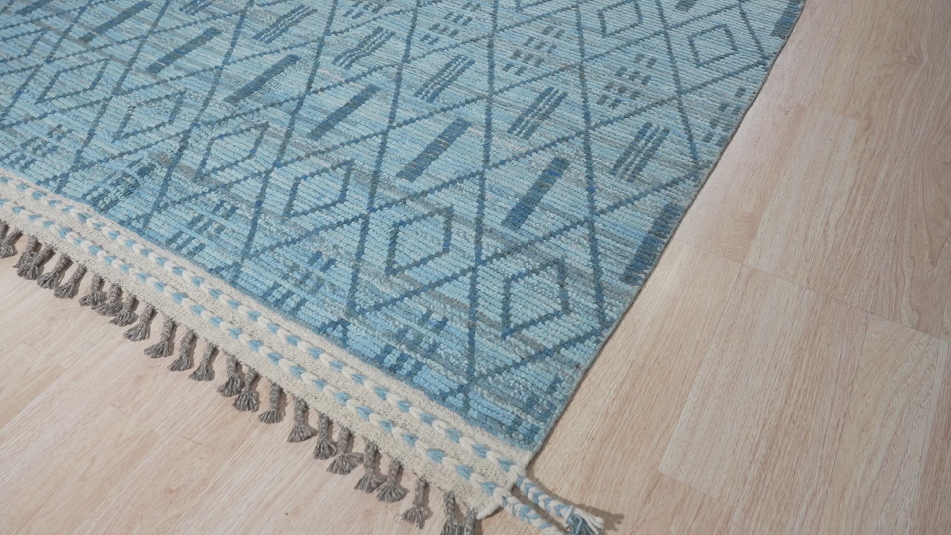 Since the image position is 12, the alt text should follow guideline 2.
 
 "Stylish Marrakech Blue Hand-Knotted Wool Rug, vibrant blues and intricate geometric patterns dance across this hand-knotted wool rug, anchoring a living space with warmth and timeless style."