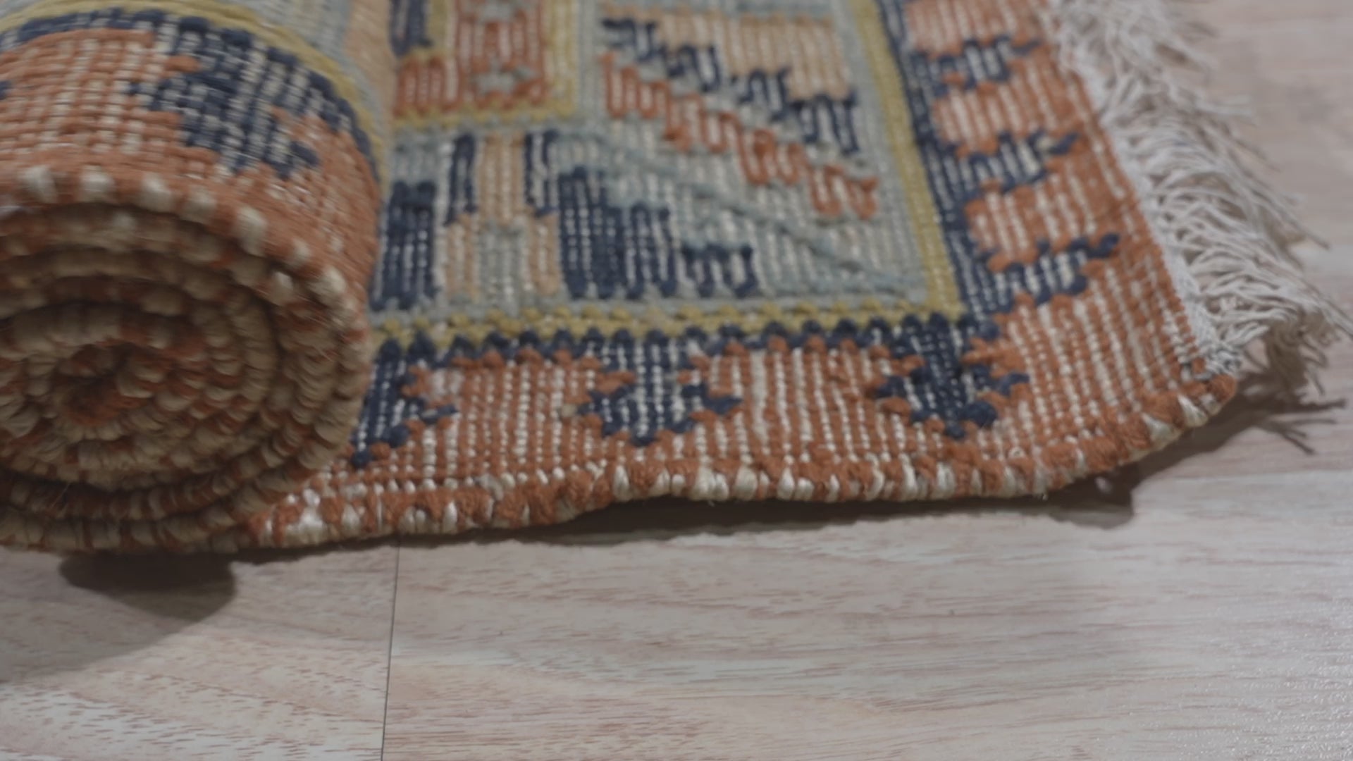 Luna Kilim Blue Hand Knotted Wool Rug, vibrant blues and geometric patterns grounding a light-filled living space, its hand-knotted texture adding warmth and subtle detail.