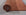 Given the image position is 12, the alt text should be:
 
 "Jasmine Alluring Orange Handmade Wool Rug, a vibrant orange wool rug likely within a styled room setting, showcasing its construction and color."