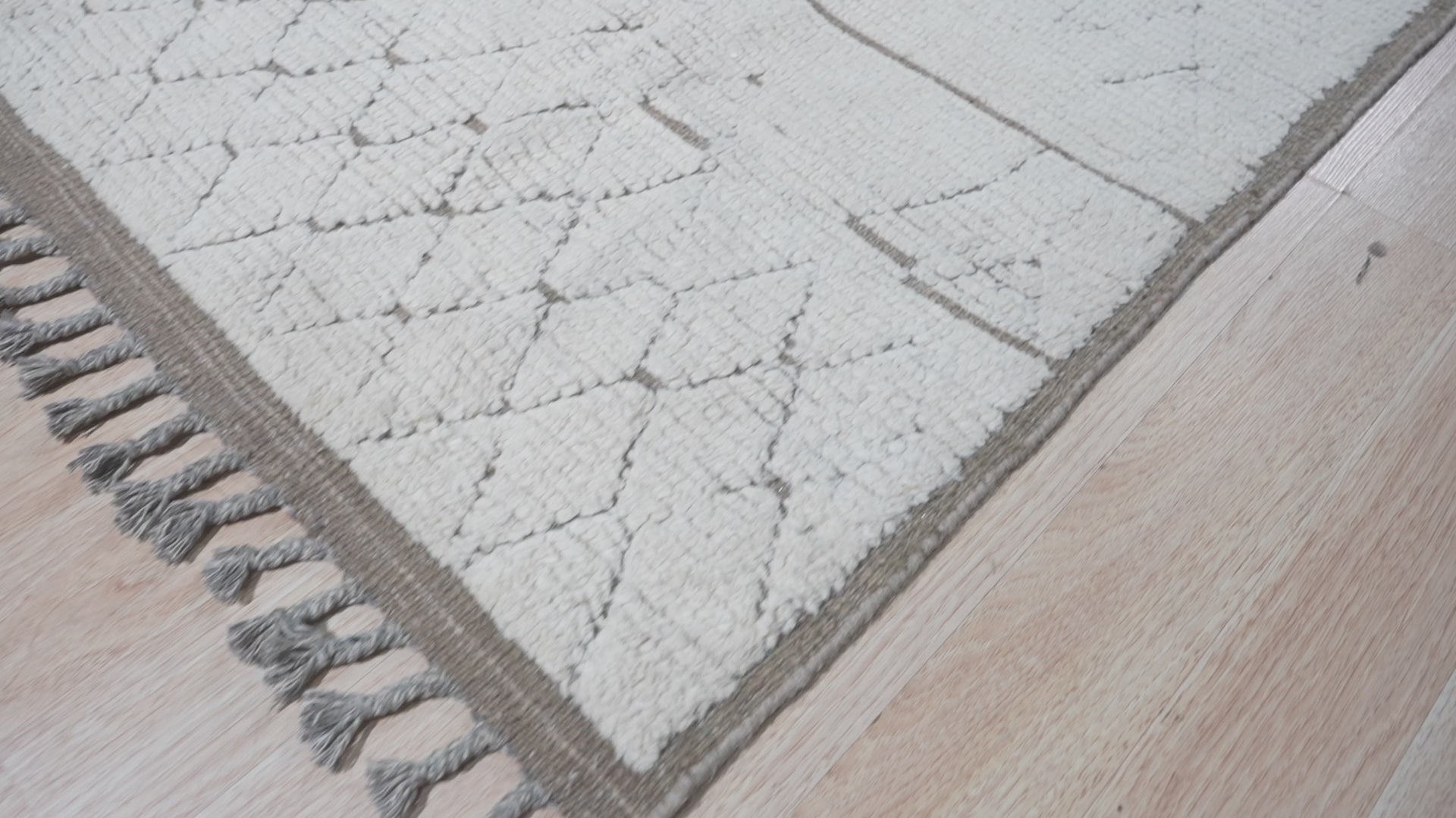 Sophisticated Marrakech Brown Hand-Knotted Wool Rug, its warm brown tones and intricate hand-knotted wool texture enriching a modern living room.