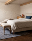 Radiant Chic Multicolor Handmade Wool Rug in a bedroom