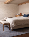 Radiant Chic Multicolor Handmade Wool Rug in a bedroom